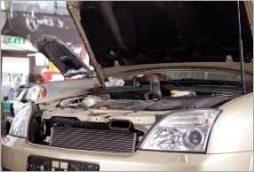 A broken down car which is sitting in the shop of The Bridge Auto in Philadelphia.